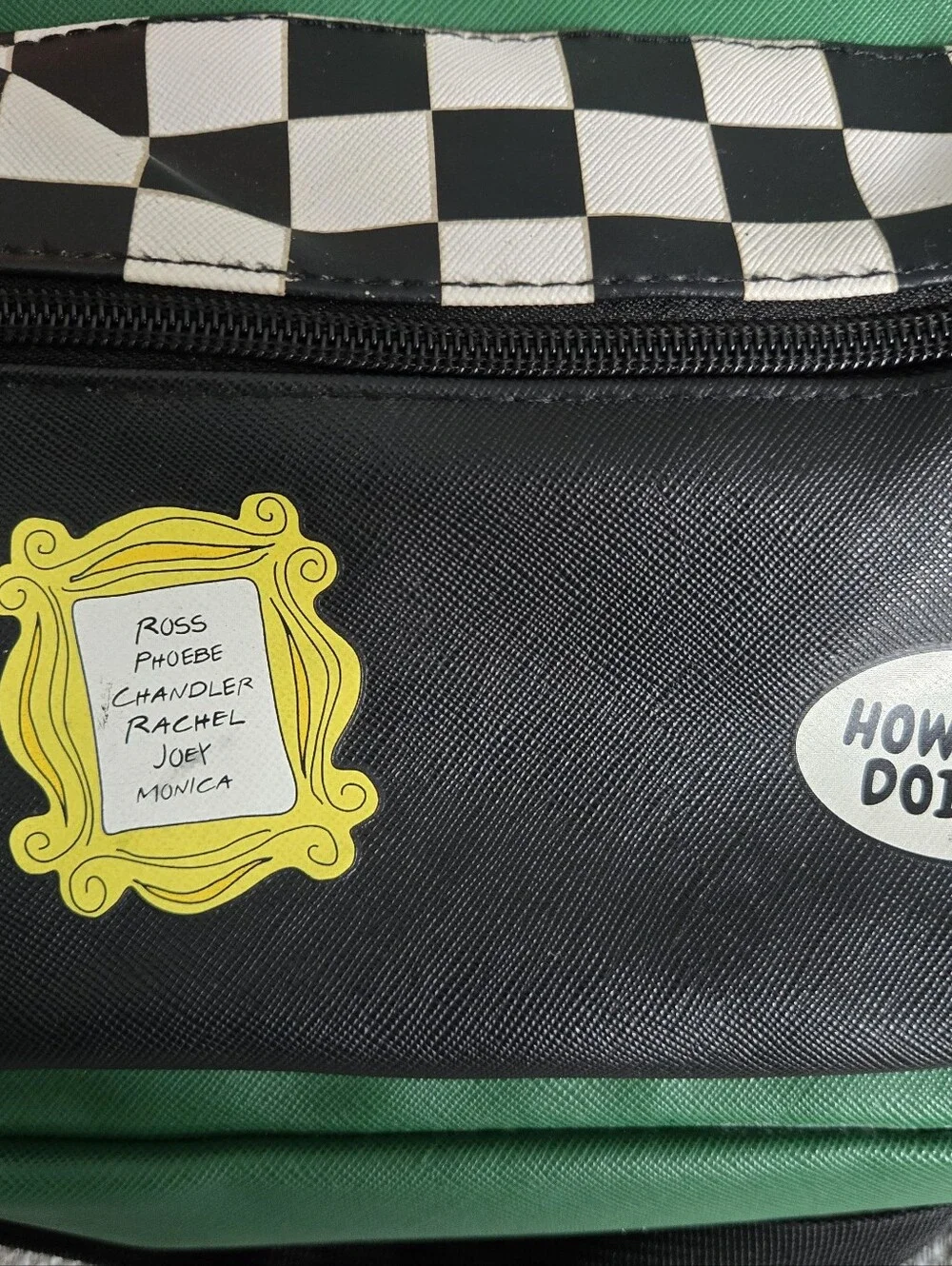 This green and black Friends Central Perk faux leather mini backpack